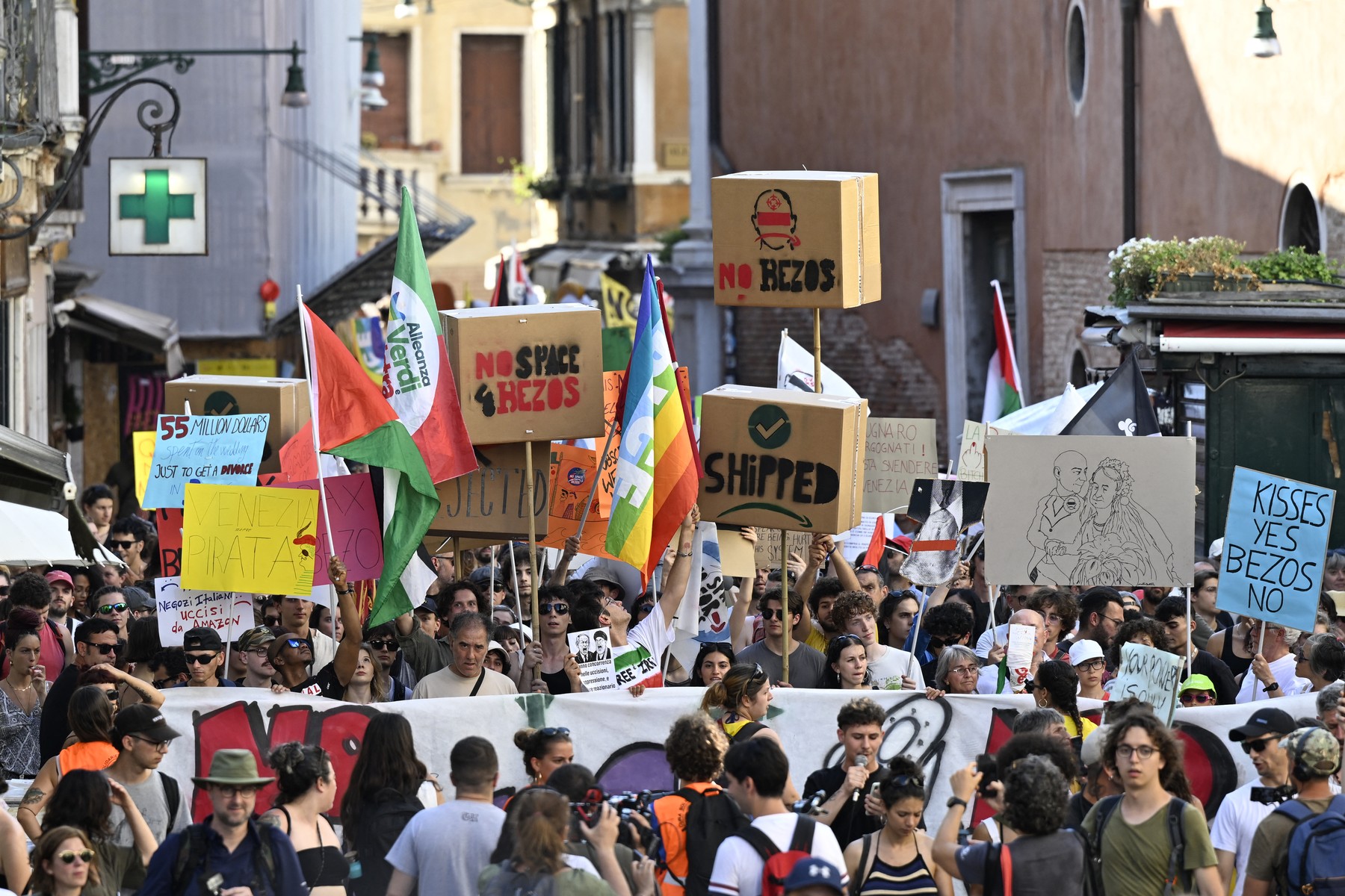 People take part in a protest 'No Space for Bezos' a day after the wedding ceremony of Jeff Bezos and Lauren Sanchez in Venice